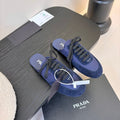 PRADA SNEAKER MULES IN NAVY BLUE NYLON AND SUEDE
