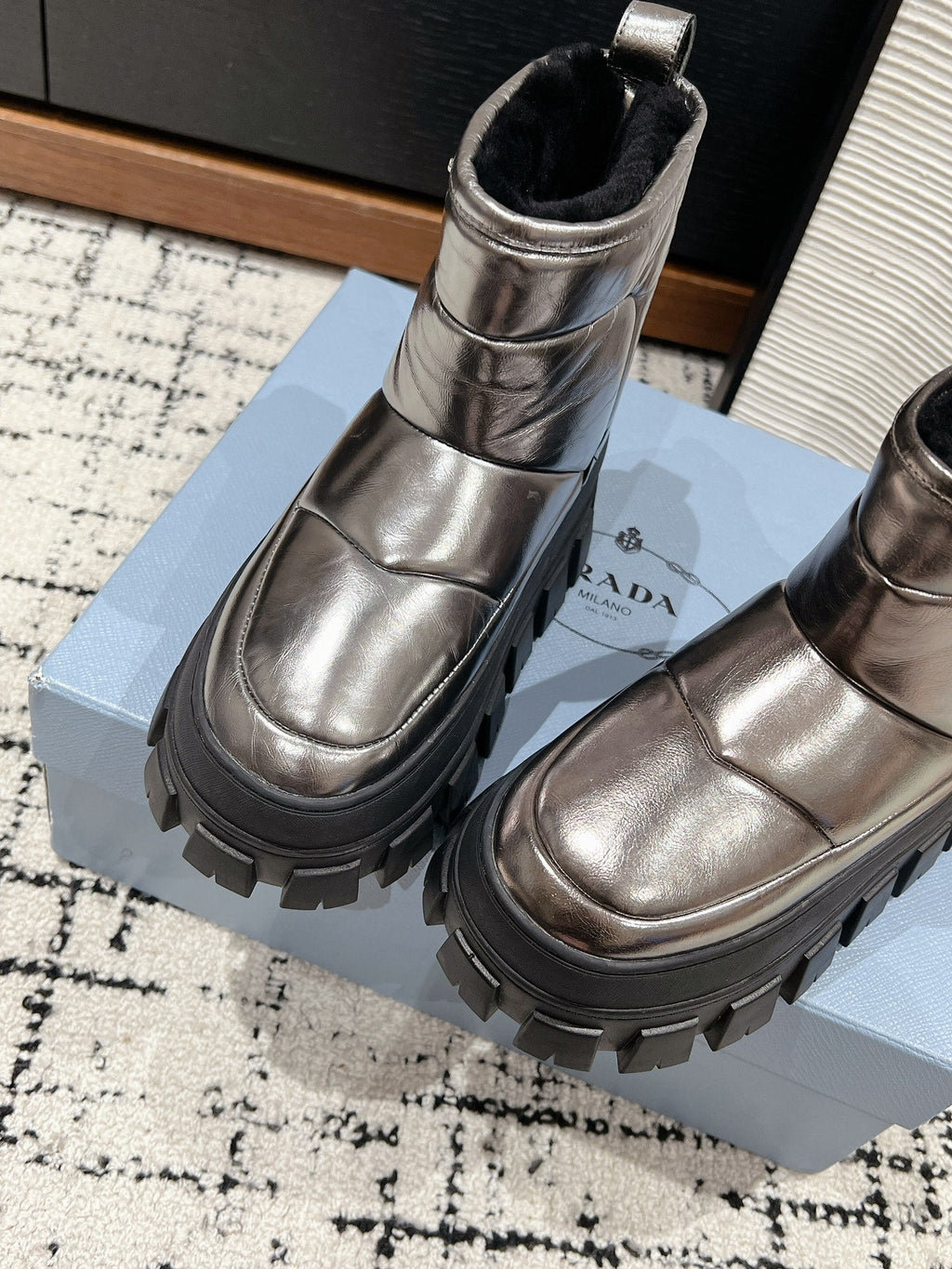 PRADA MONOLITH ANKLE BOOTS IN METALLIC GRAY CALFSKIN AND LAMB FUR LINING